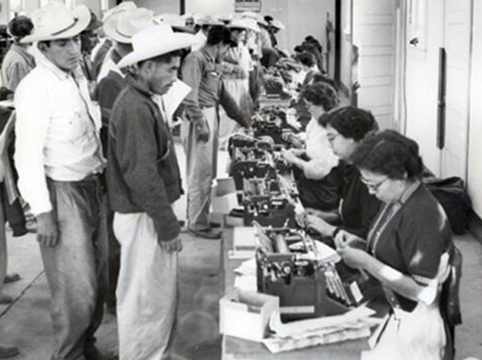Image of Temporary clerks typed I-100(a) & (b) and fingerprint cards after obtaining necessary information from the applicant. All clerks were proficient in both English and Spanish. Rio Vista Reception Center, El Paso, Texas.
